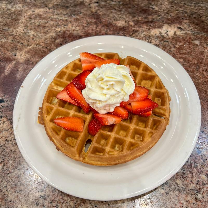 Fresh strawberry waffle, whipped cream