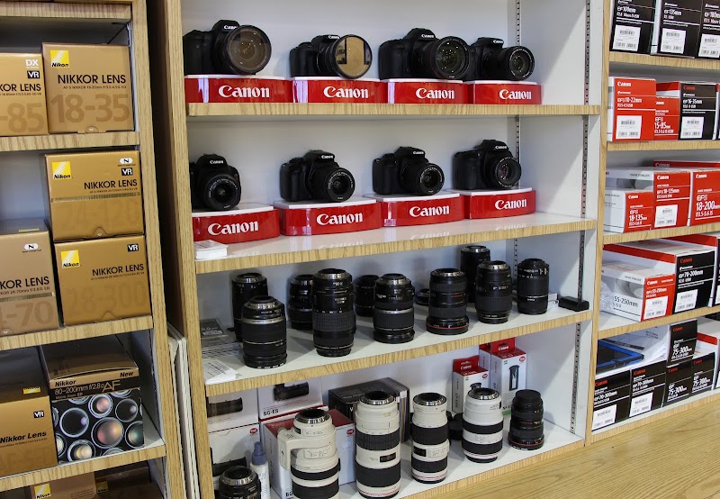 Cameras and lenses on shelves