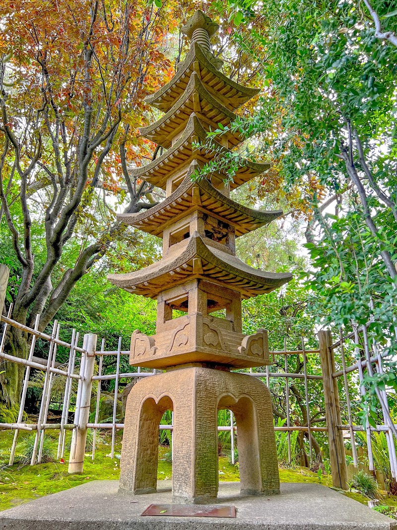 Granite pagoda among autumn trees
