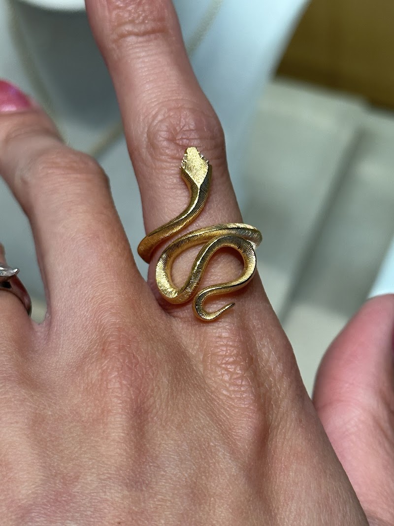 Gold serpent ring, tried on