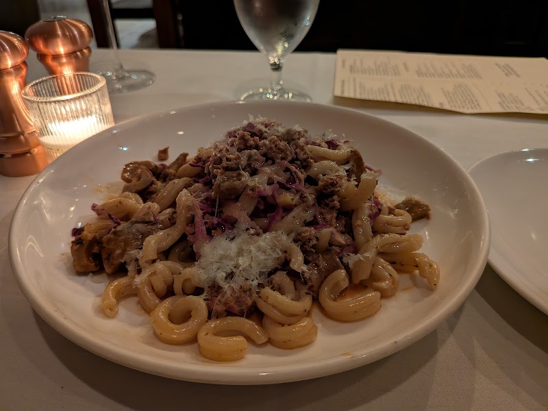 Hearty pasta, candlelit table