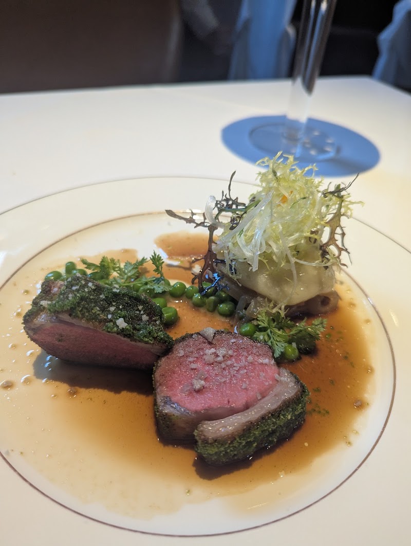 Herb-crusted lamb, elegant plating