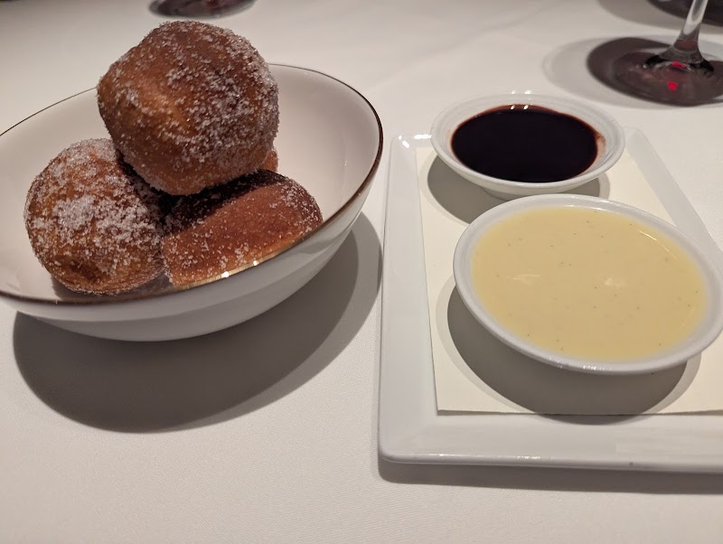 Warm beignets, two dipping sauces