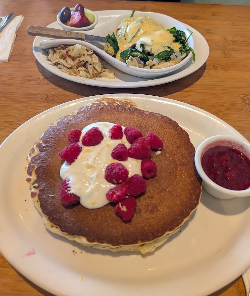 Pancakes topped with fresh raspberries