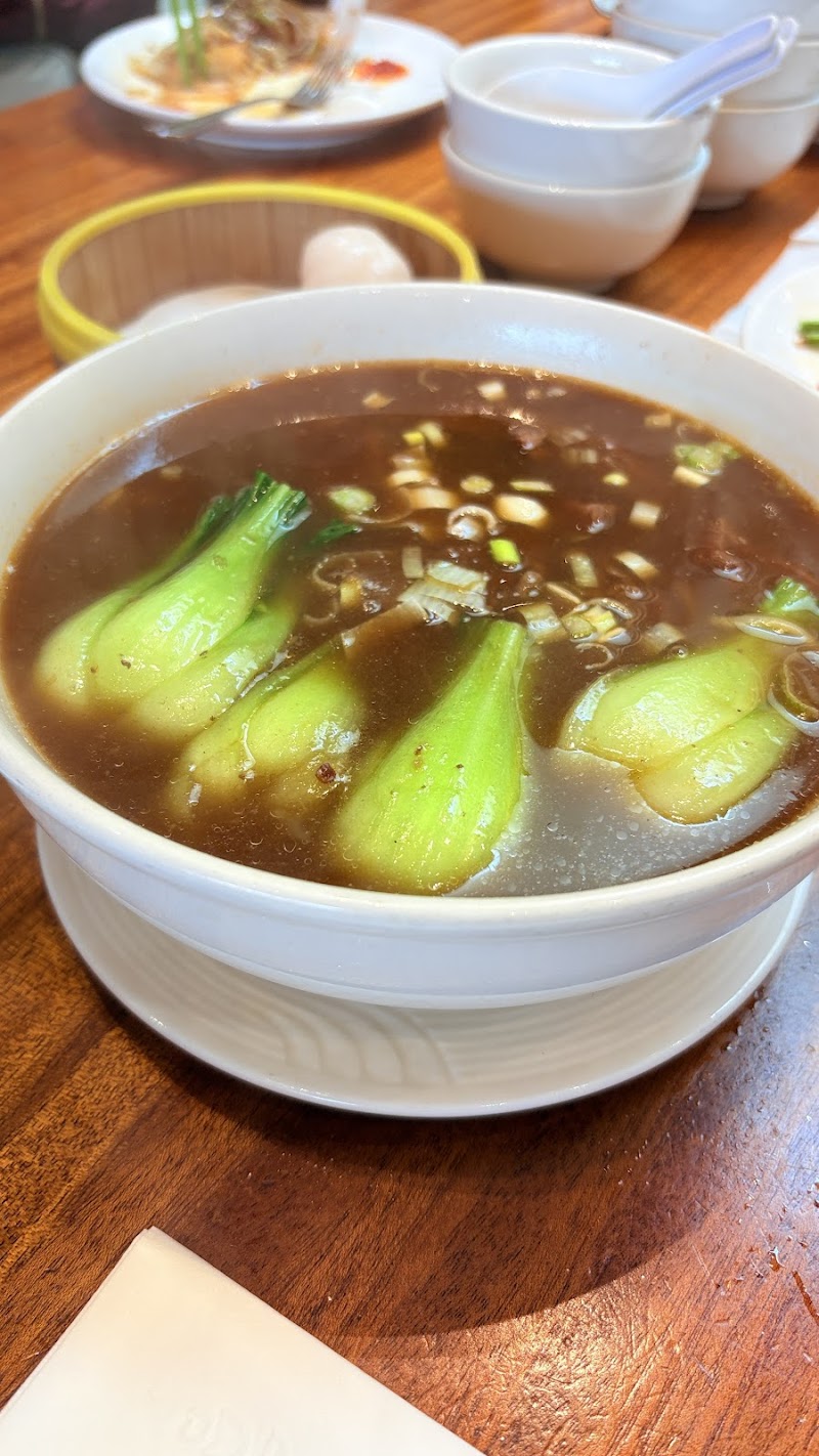 Rich braised broth with bok choy