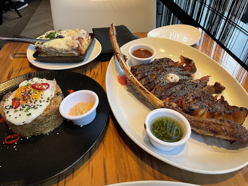 Tomahawk steak, sides spread