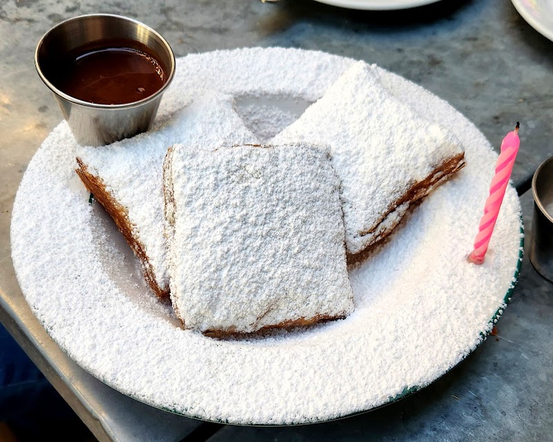 Powdered beignets, dipping sauce