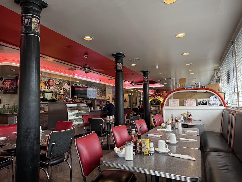 Red booths, lively diner floor