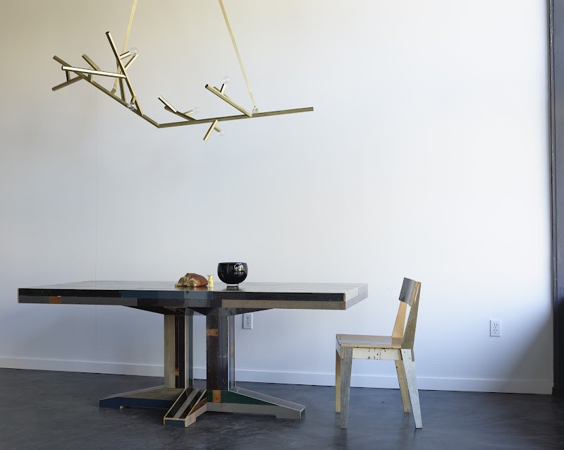 Branch-lit artisan dining space