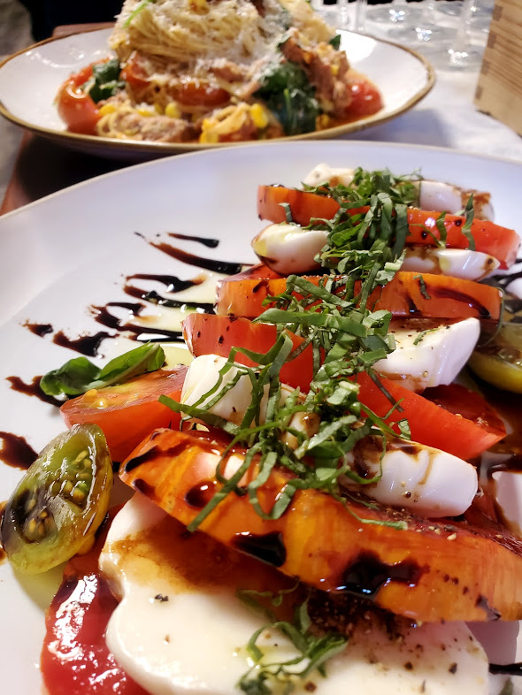 Fresh caprese and pasta plates