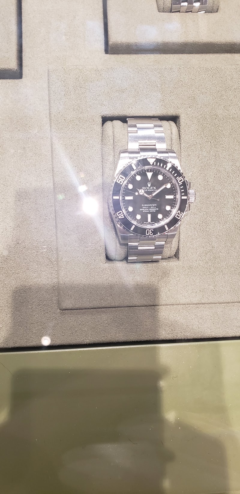 Luxury timepiece under glass