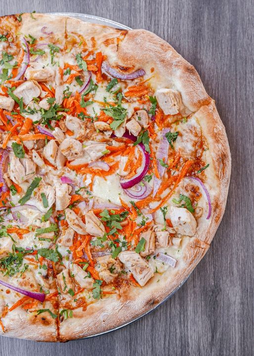 Loaded chicken pizza, fire-kissed