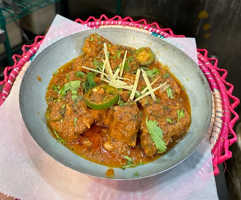 Rich curry, fresh garnish