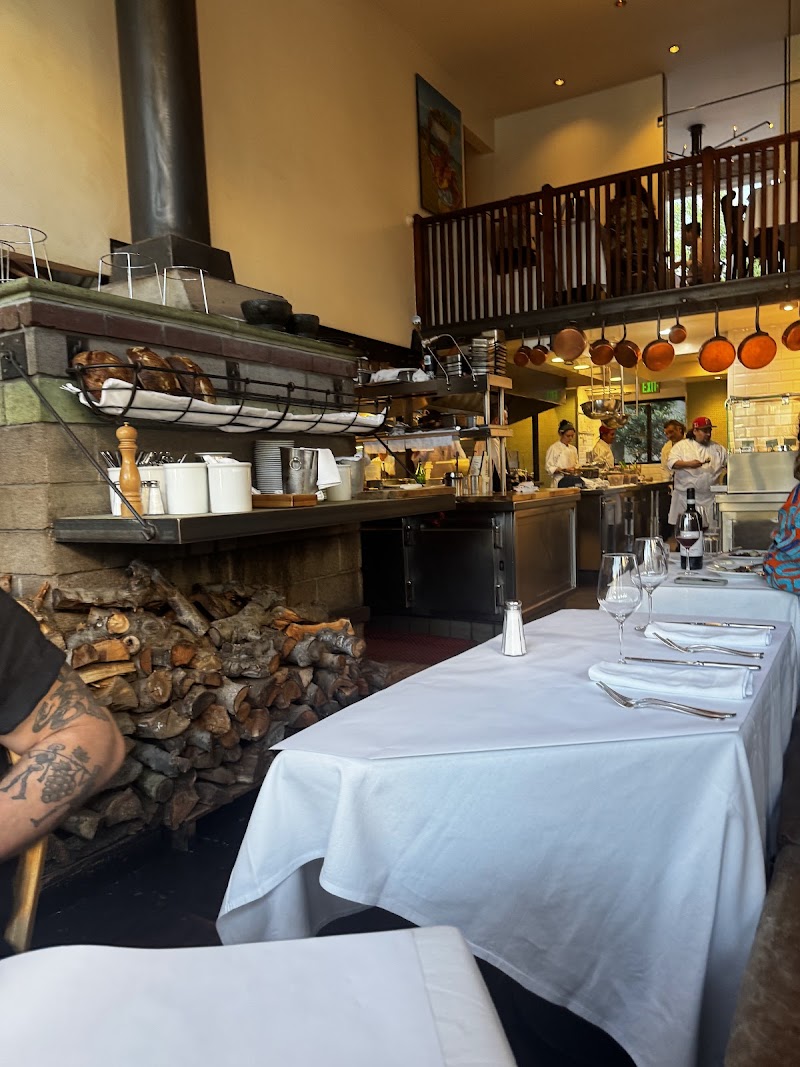 Wood-fired hearth, linen tables
